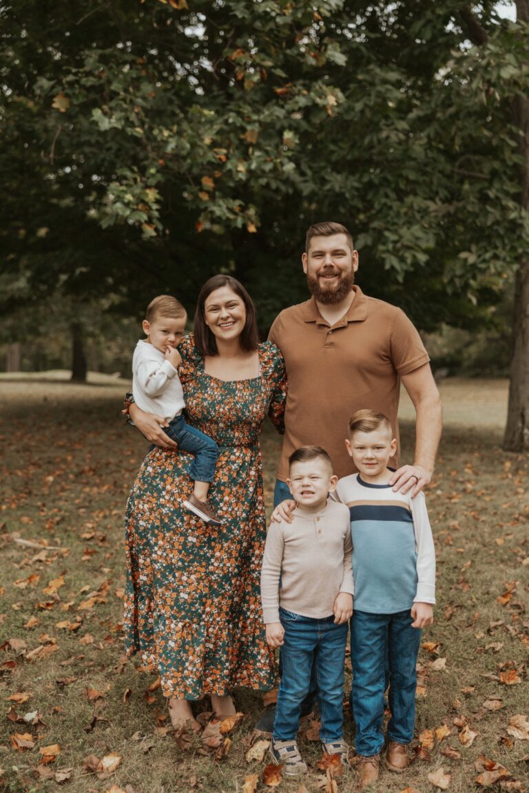 Caitlyn Sullivan with her husband and their three boys outside in the fall